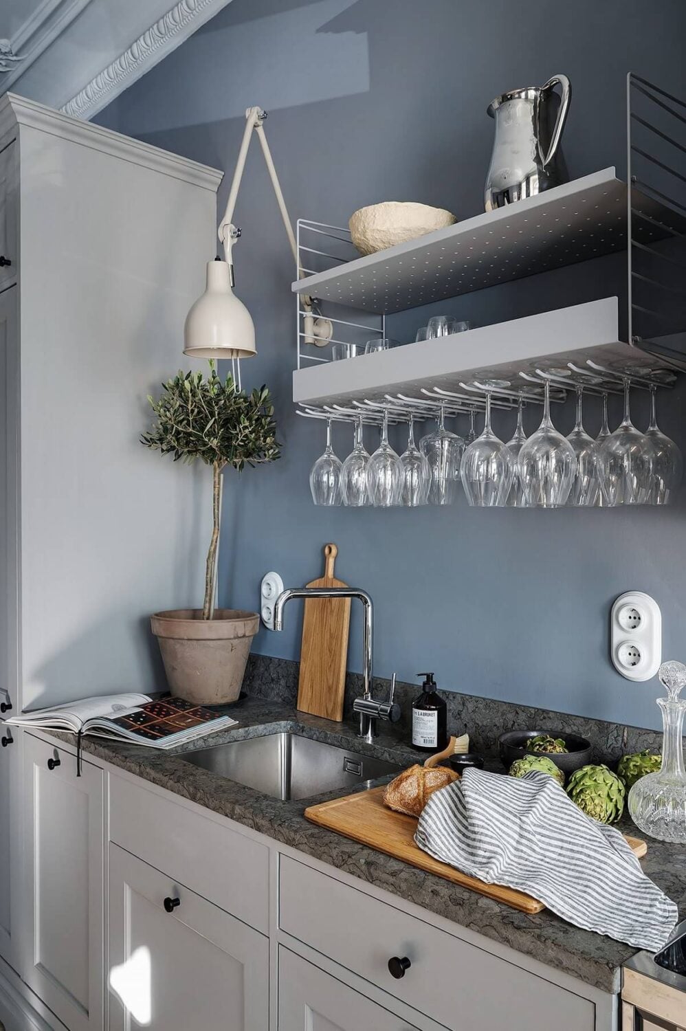 A Luxurious Blue and Gray Studio Apartment 7 light-gray-kitchen-cabinets-blue-walls-nordroom