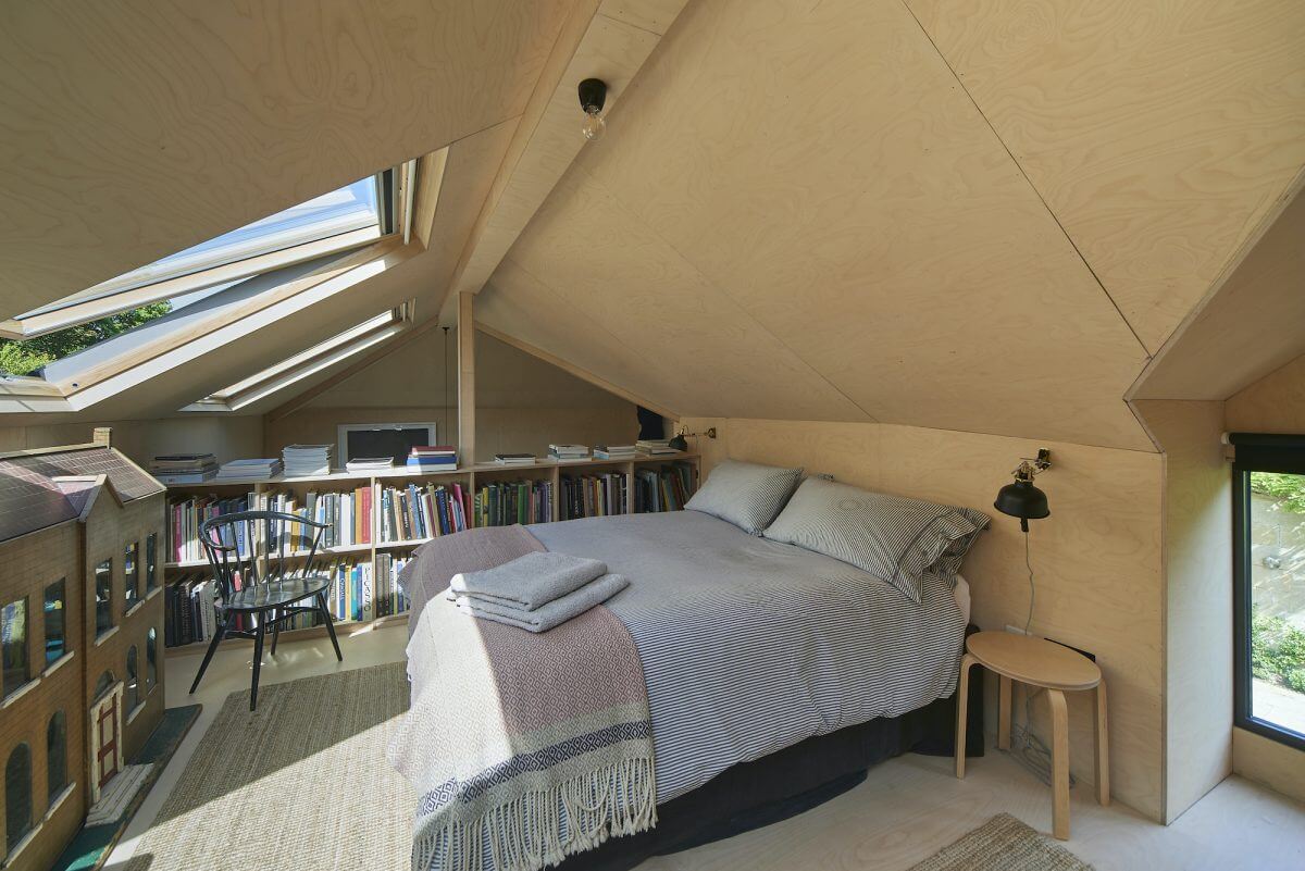 A Mixture of Styles in an English Home 23 loft-bedroom-bookshelves-skylight-contemporary-art-studio-nordroom