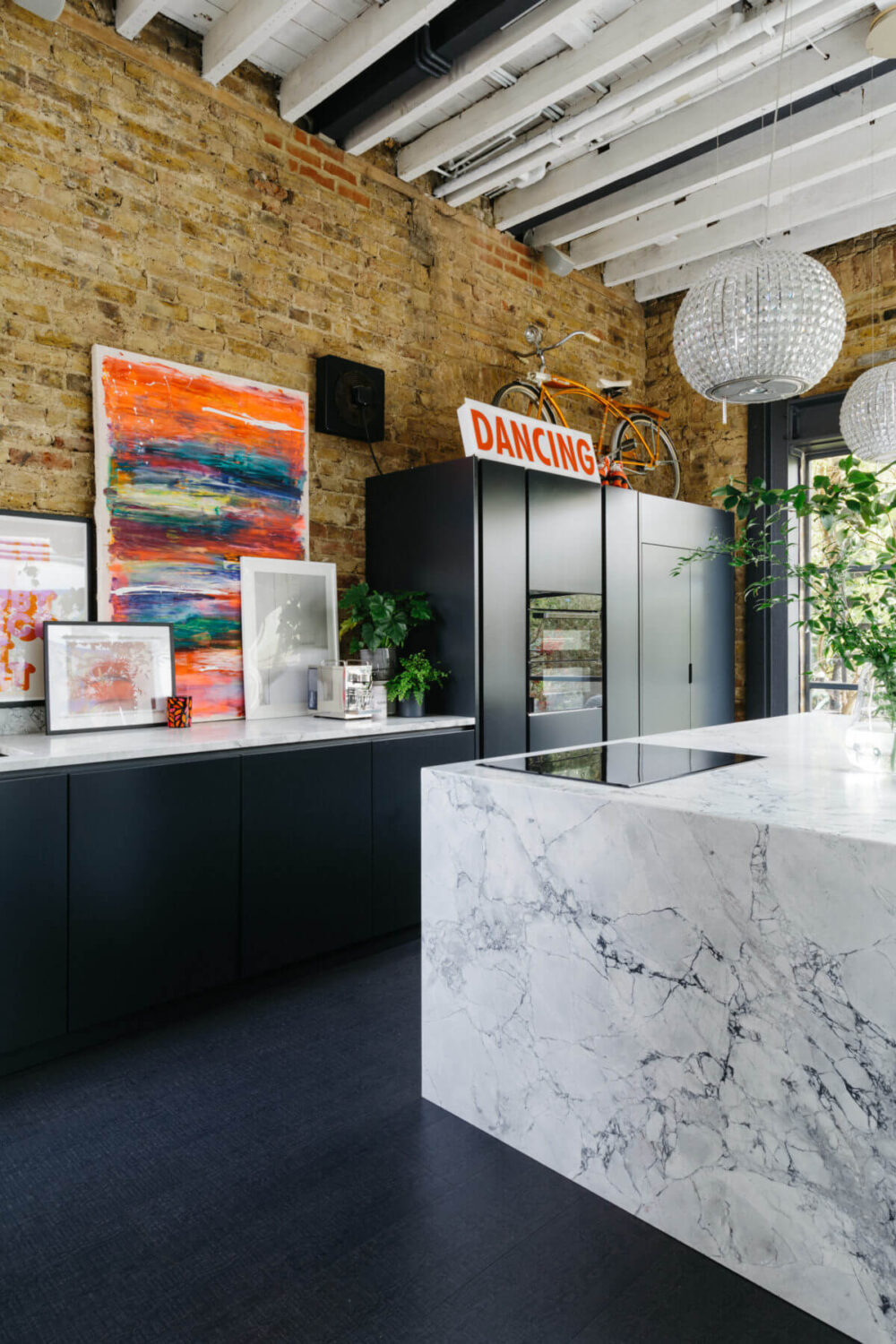 A Black and White Victorian House in London 3 marble-kitchen-island-black-kitchen-cabinets-brick-wall-nordroom