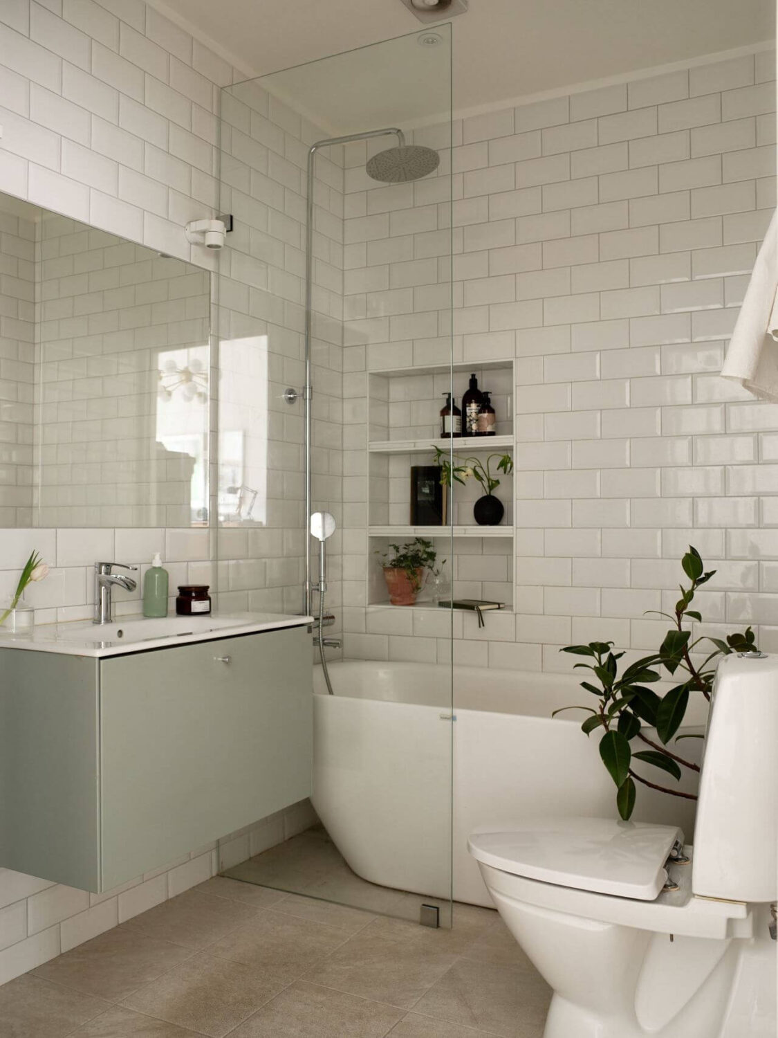 Simple Bathroom Design Ideas That Will Wow You 8 minimalistic-bathroom-freestanding-bath-storage-niche-white-tiles-nordroom