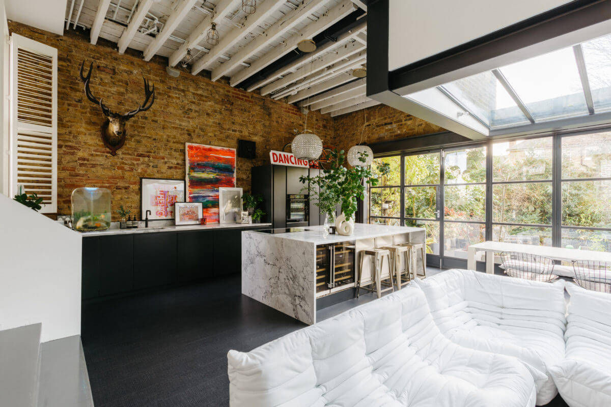 A Black and White Victorian House in London 1 modern-open-plan-kitchen-sitting-room-marble-island-brick-wall-nordroom