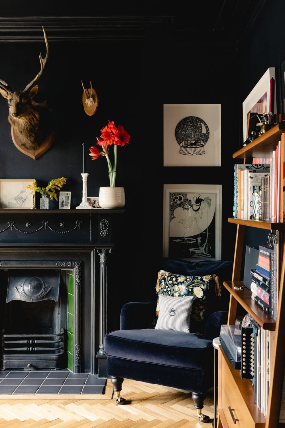 A Green Kitchen with Pink Ceiling in a Colorful London Home 8 moody-blue-dining-room-velvet-blue-chair-black-fireplace-nordroom