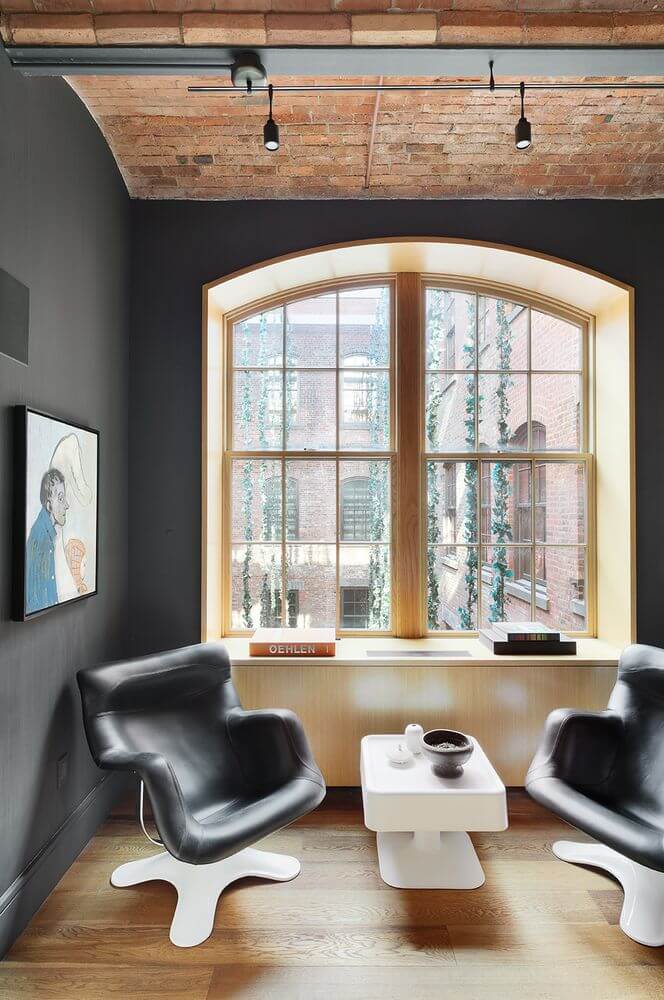 Jonah Hill Sells His Modern Manhattan Loft 13 moody-sitting-room-vaulted-ceiling-modern-loft-manhattan-nordroom