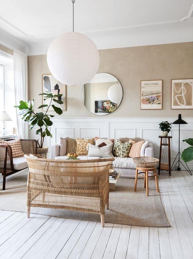 A Lovely Natural Apartment in Sweden 2 natural-living-room-wooden-floor-round-mirror-wood-panels-nordroom