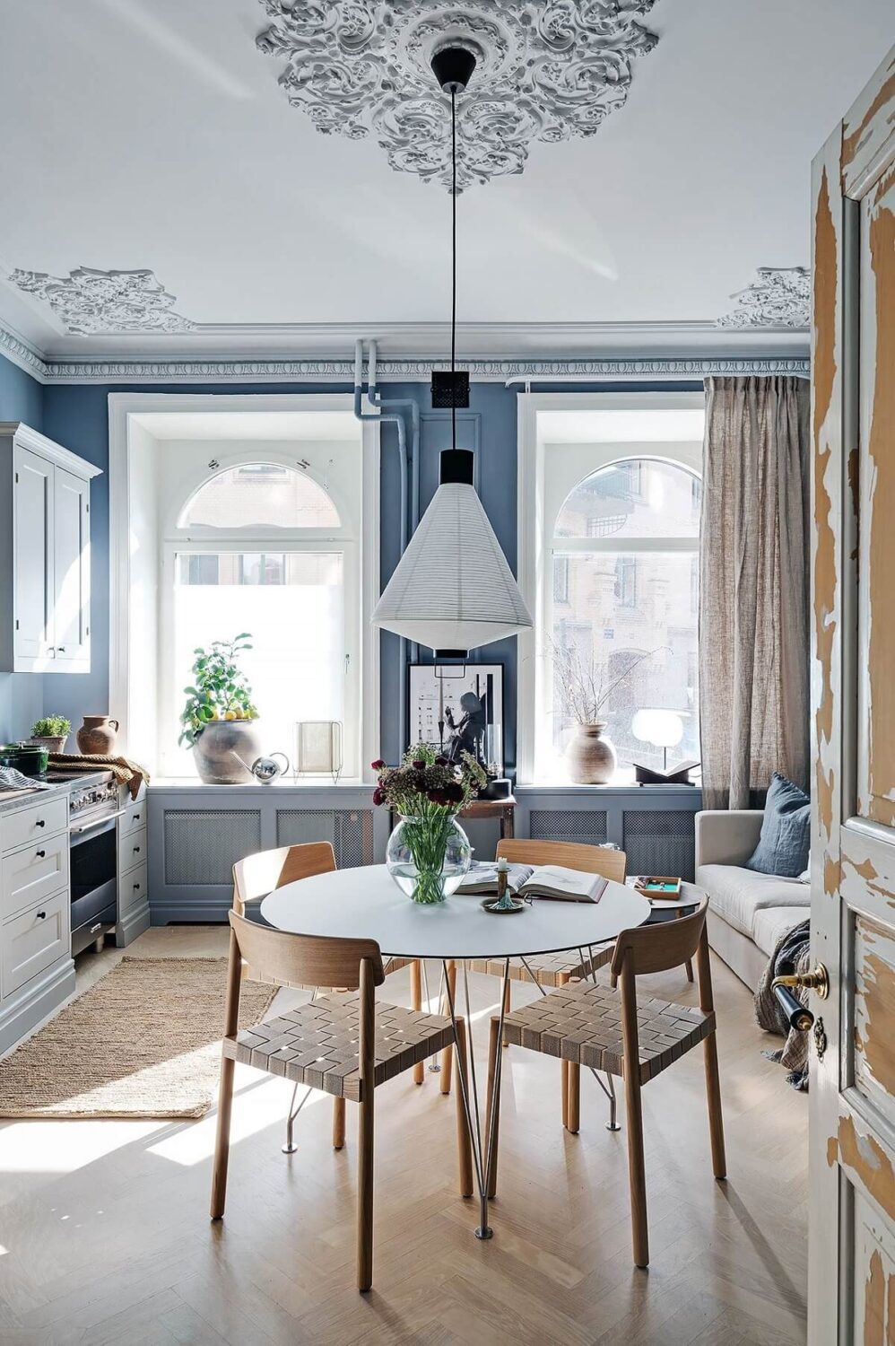 A Luxurious Blue and Gray Studio Apartment 5 round-dining-table-blue-gray-studio-apartment-nordic-design-nordroom