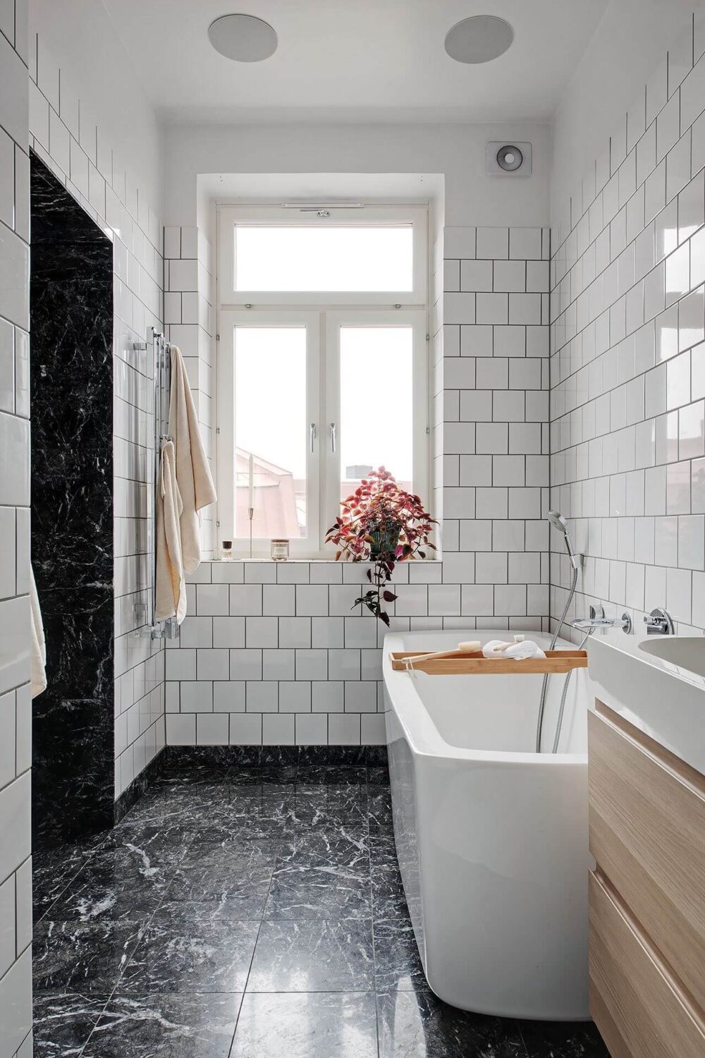 Simple Bathroom Design Ideas That Will Wow You 14 simple-bathroom-black-marble-floor-freestanding-bath-nordroom