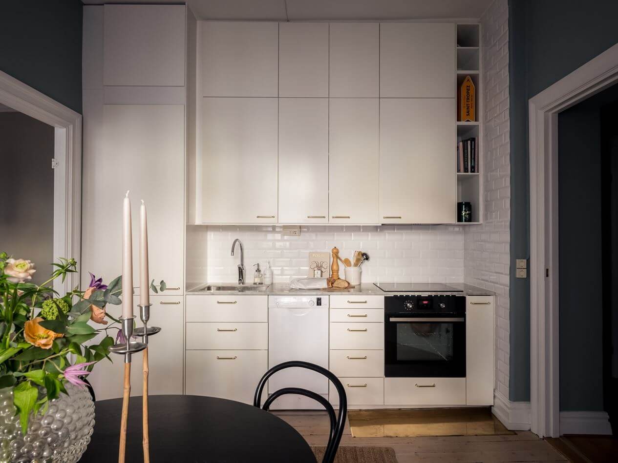 A Gray Studio Apartment with Spacious Kitchen 8 white-kitchen-gray-studio-apartment-nordroom