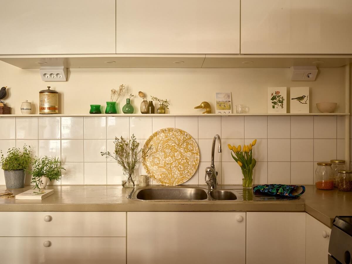 A Small Vintage Apartment with Warm Yellow Walls 10 white-kitchen-grey-wood-countertop-nordroom
