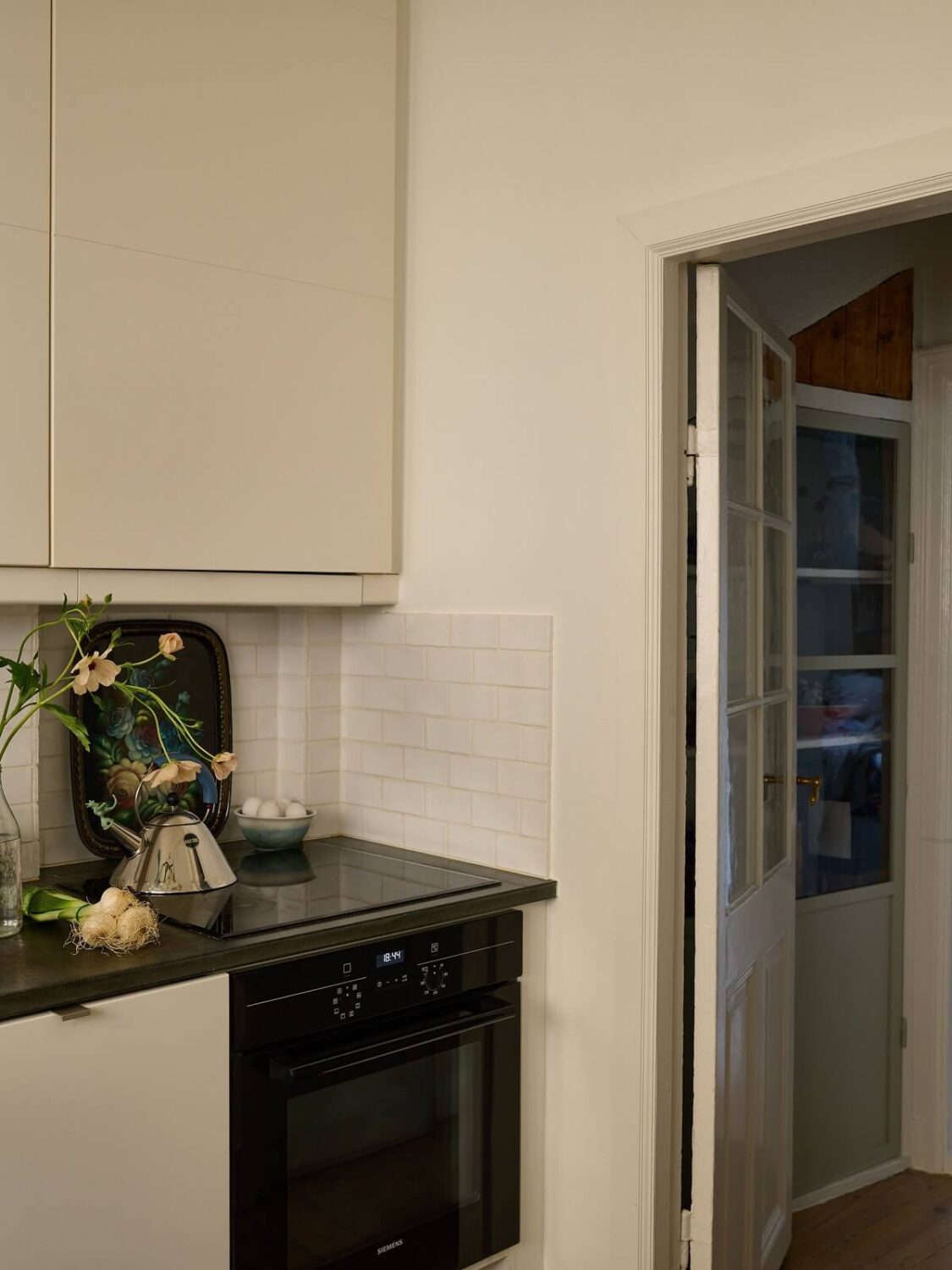 A Cozy Plant-Filled Home in Sweden 16 white-kitchen-plant-filled-scandinavian-home-nordroom