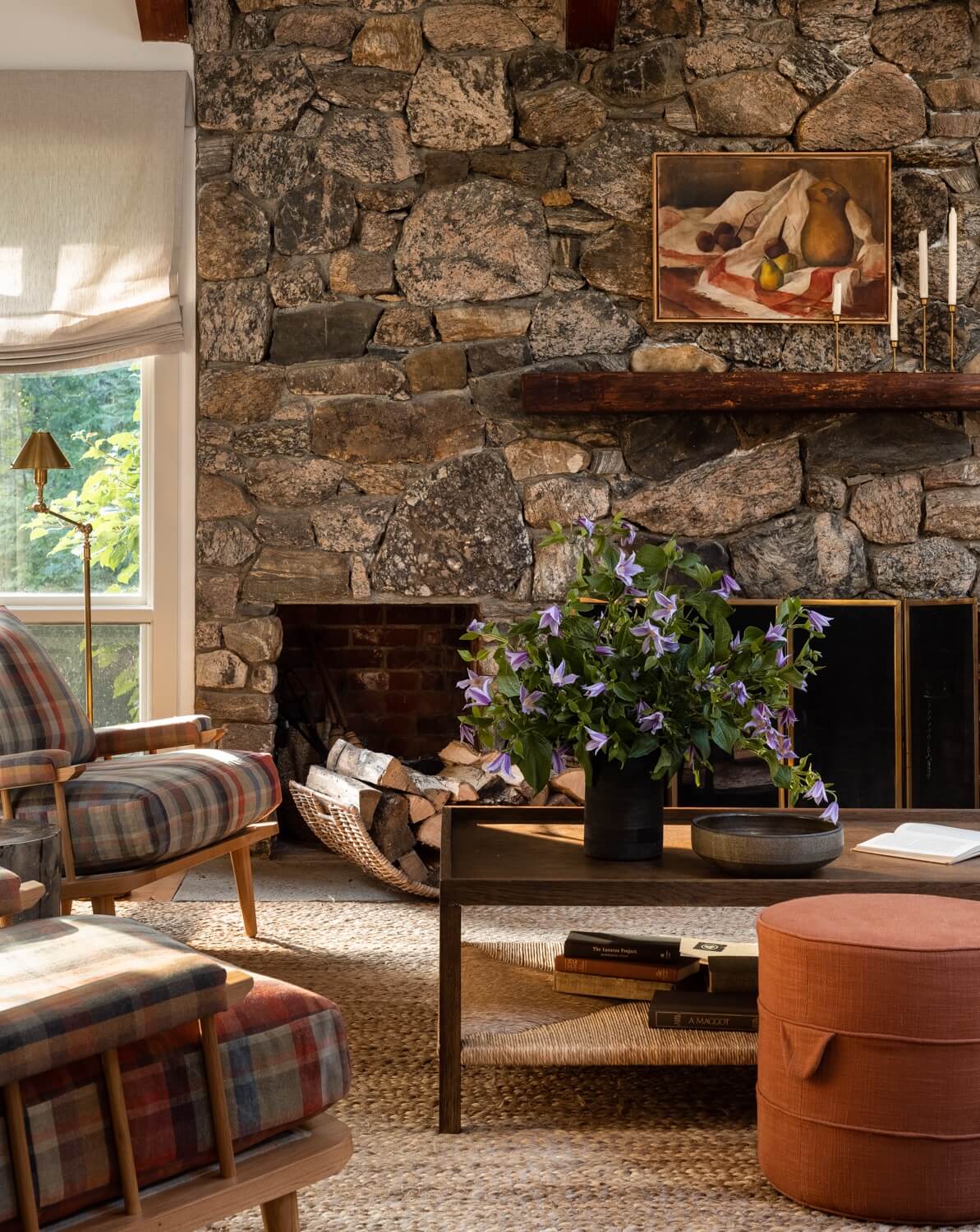 A Warm Country House in Dutchess County 4 Heidi-Caillier-Design-CT-country-house-Dutchess-County-design-living-room-stone-fireplace-beams-jute-rug-amber-interiors-table-Nordroom