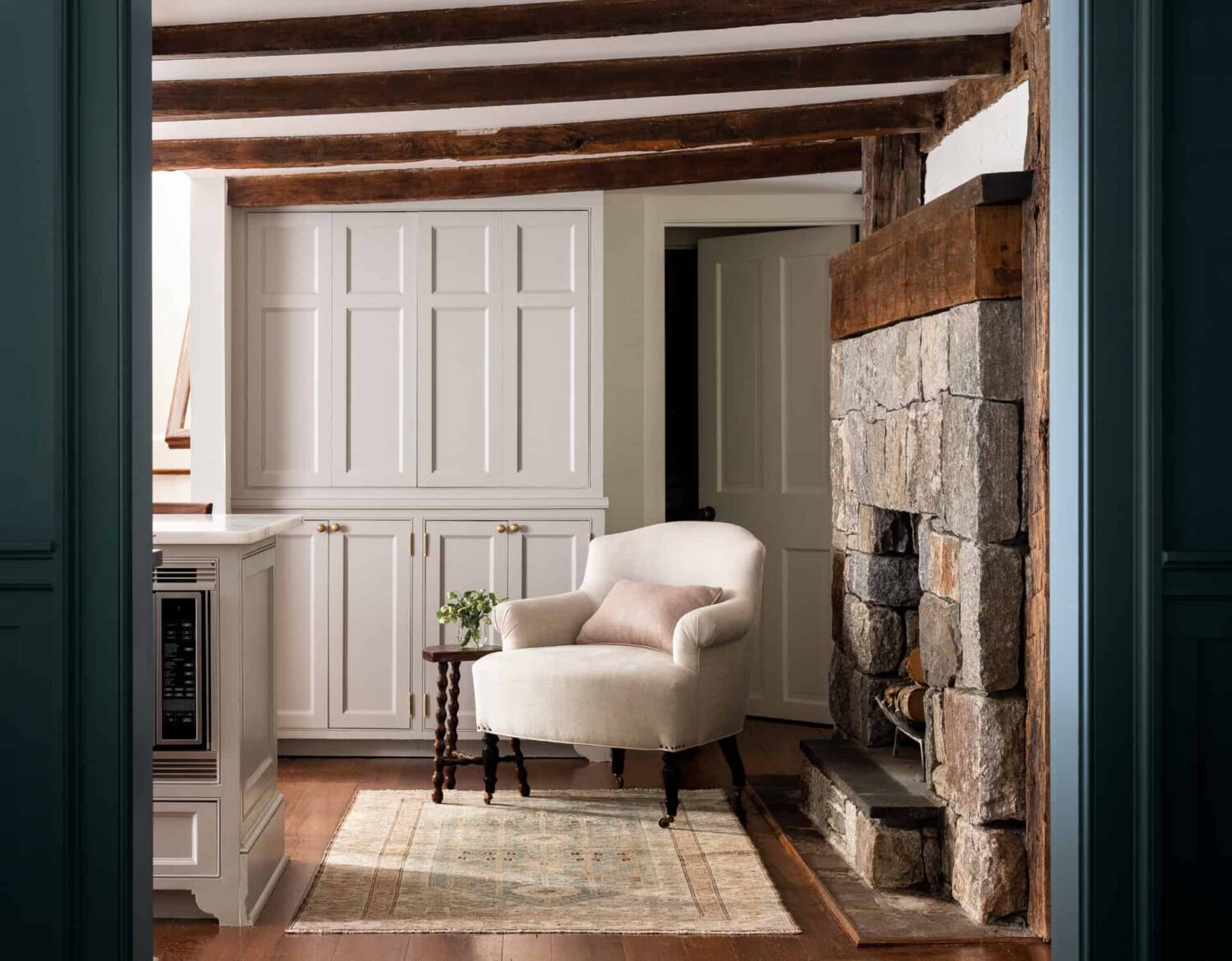 Patterns and Historic Charm in a Bedford Home 18 Heidi-Caillier-Design-Hudson-Valley-farmhouse-kitchen-old-beams-pantry-lounge-chair-Nordroom