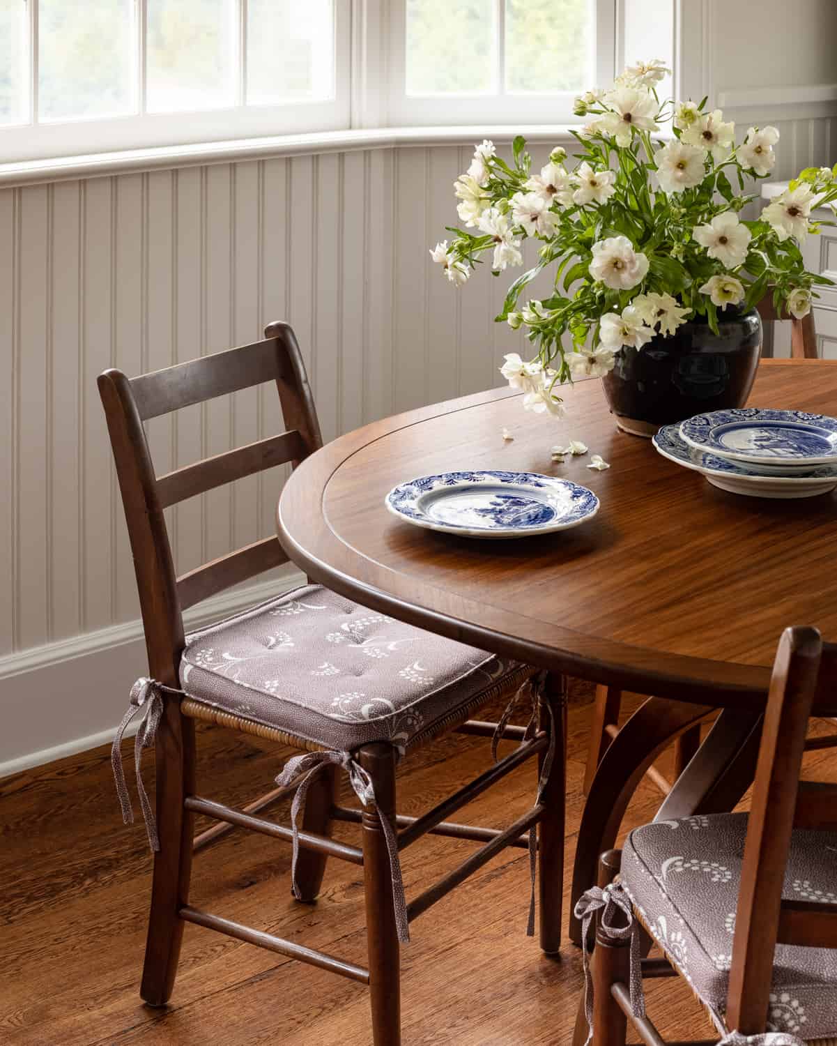 Patterns and Historic Charm in a Bedford Home 21 Heidi-Caillier-Design-Hudson-Valley-farmhouse-kitchen-old-beams-vintage-cane-dining-chairs-Nordroom