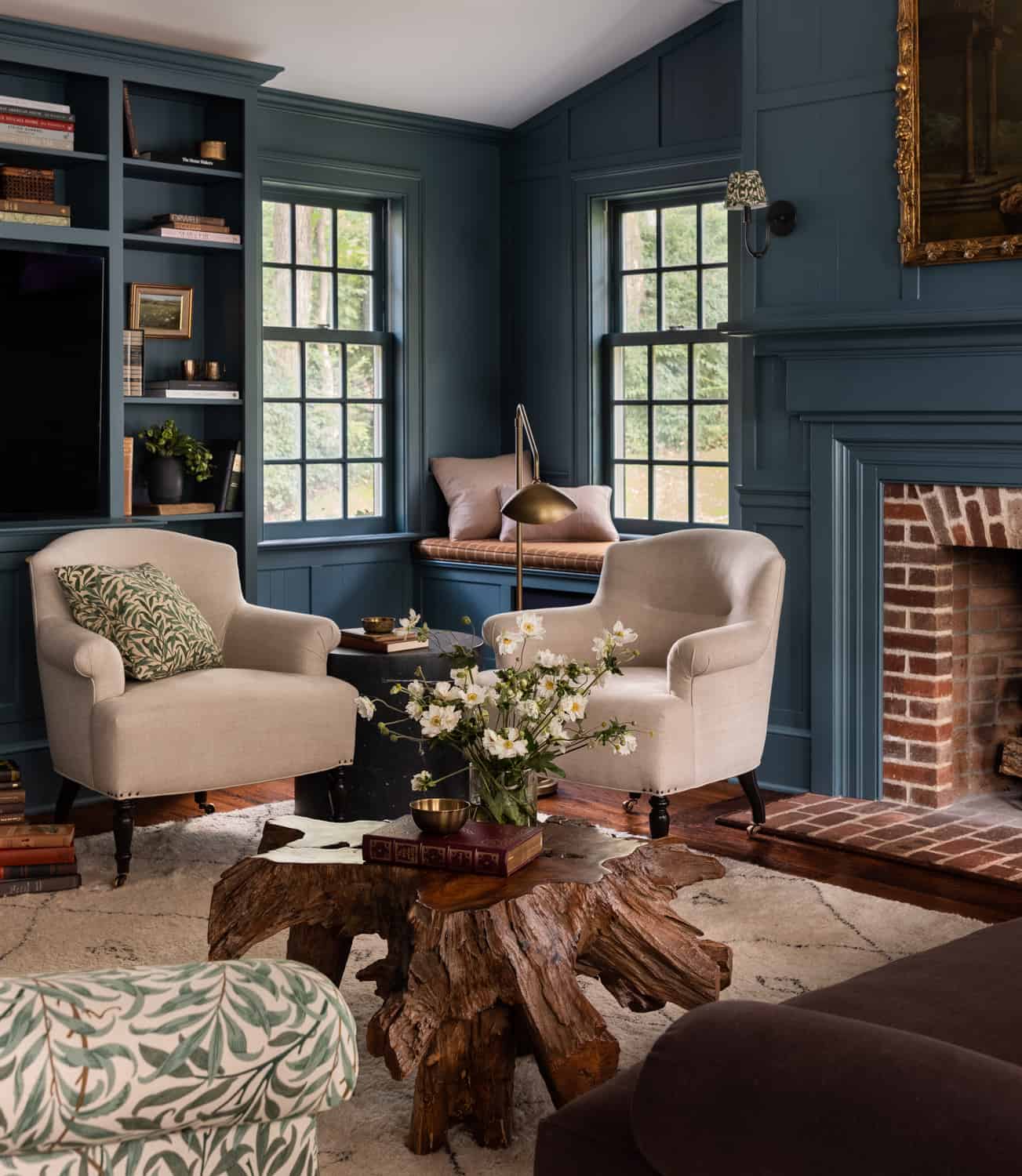 Patterns and Historic Charm in a Bedford Home 3 Heidi-Caillier-Design-Hudson-Valley-house-dark-blue-family-room-william-morris-sofa-vintage-floral-painting-cozy-nordroom