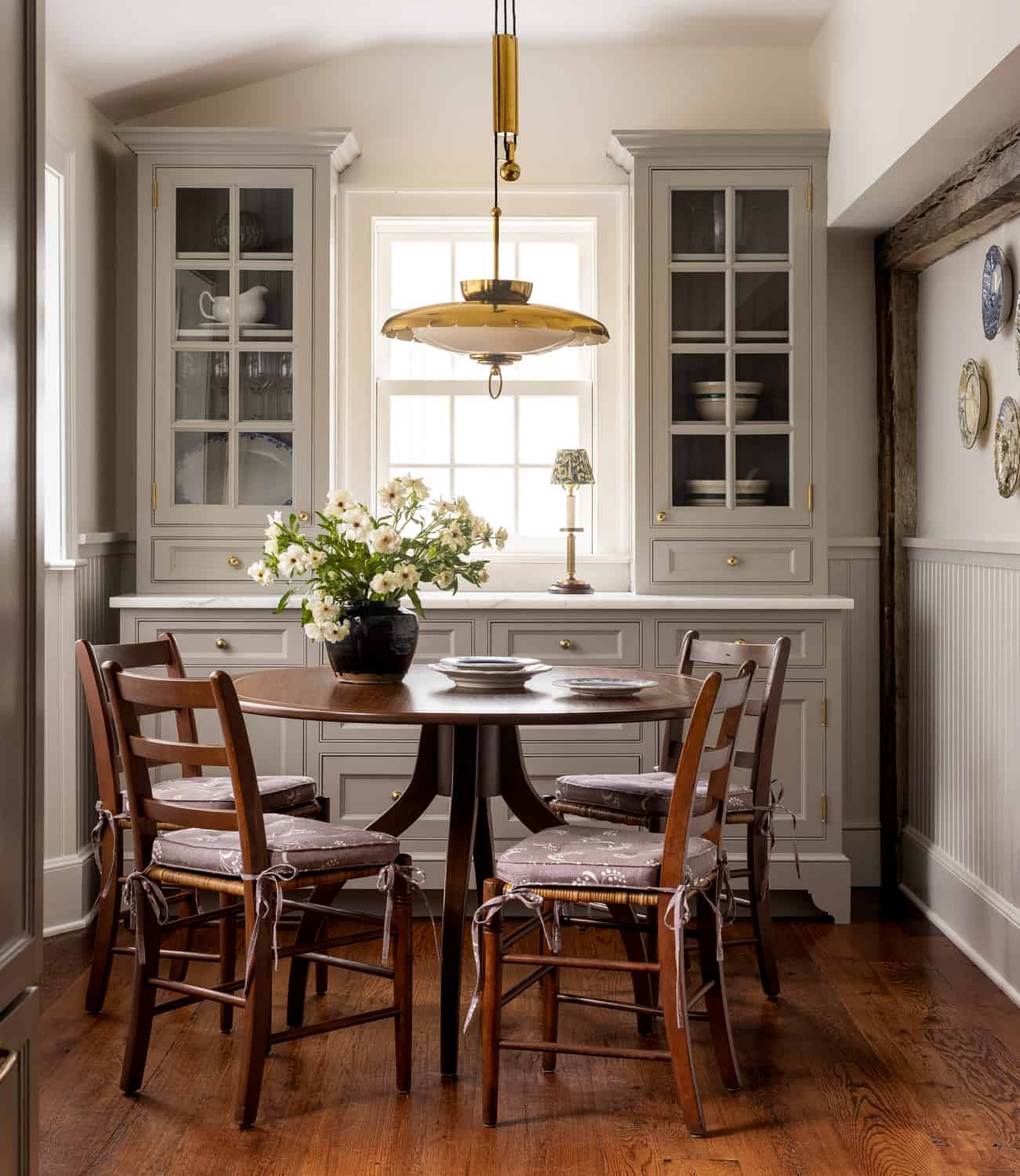 Patterns and Historic Charm in a Bedford Home 22 Heidi-Caillier-Design-Hudson-Valley-house-dining-nook-rattan-dining-chairs-vintage-midcentury-light-Nordroom