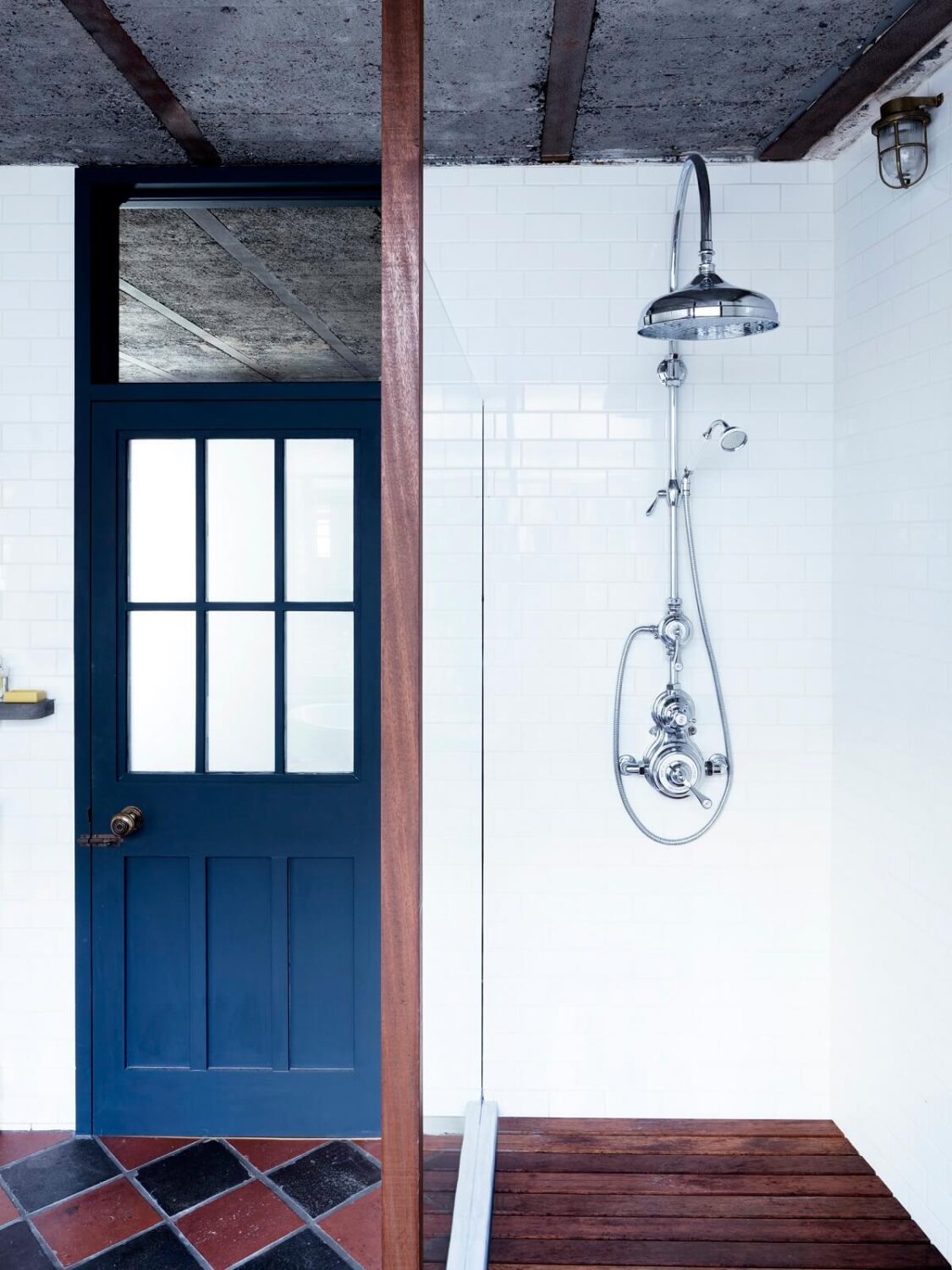 An Industrial Apartment by Mark Lewis Interior Design 18 bathroom-blue-door-shower-mark-lewis-interior-design-nordroom
