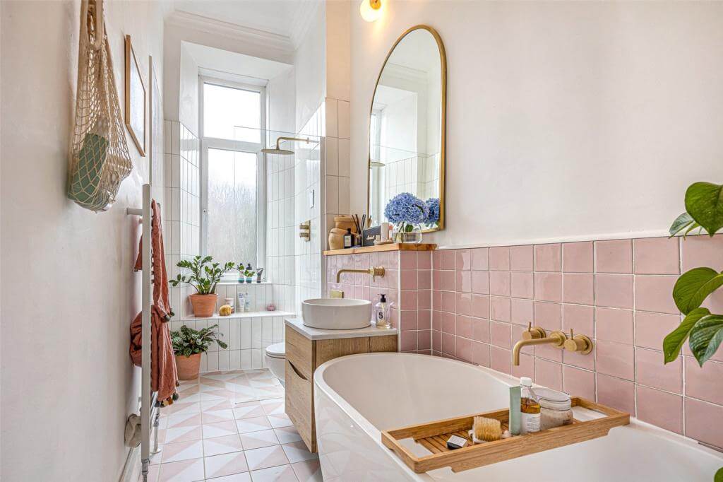 Kate Spiers Sells Her Beautiful Light Flat in Glasgow 16 bathroom-green-tiles-arched-mirror-freestanding-bath-shower-nordroom