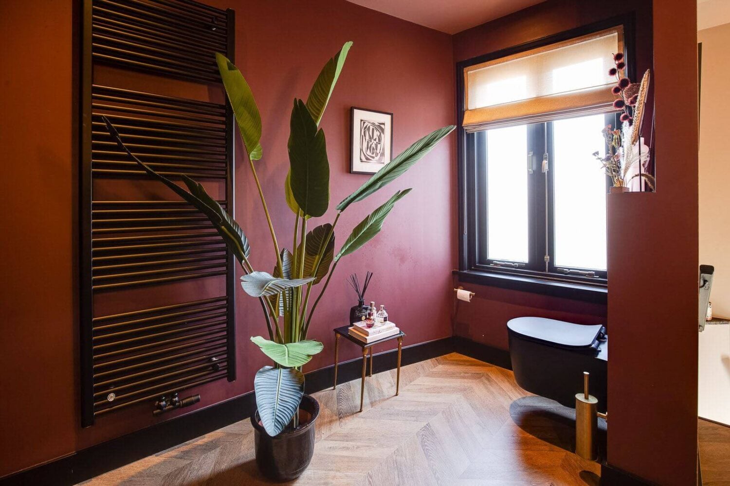 A Dutch Family Home with Warm Color Accents 18 bathroom-terracotta-walls-black-accents-toilet-nordroom