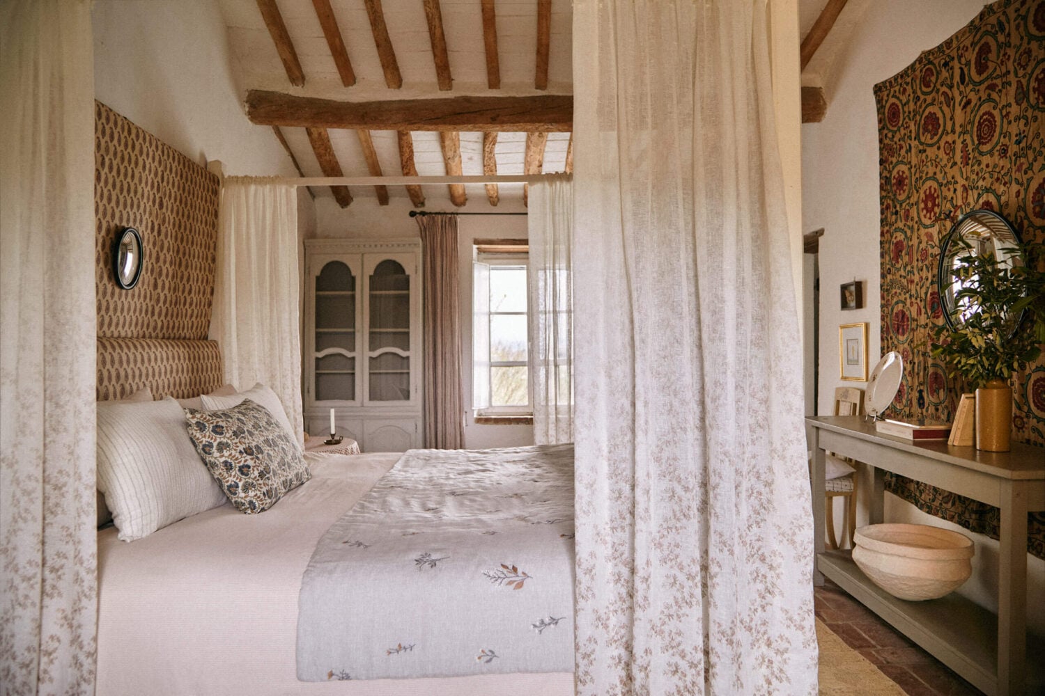 A Tuscan Villa by Zara Home 13 bedroom-canopy-bed-exposed-wooden-beams-tuscan-villa-azra-home-nordroom