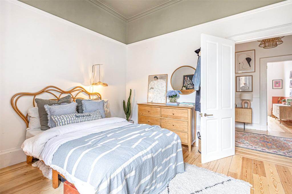 Kate Spiers Sells Her Beautiful Light Flat in Glasgow 19 bedroom-rattan-headboard-wooden-floor-green-ceiling-nordroom