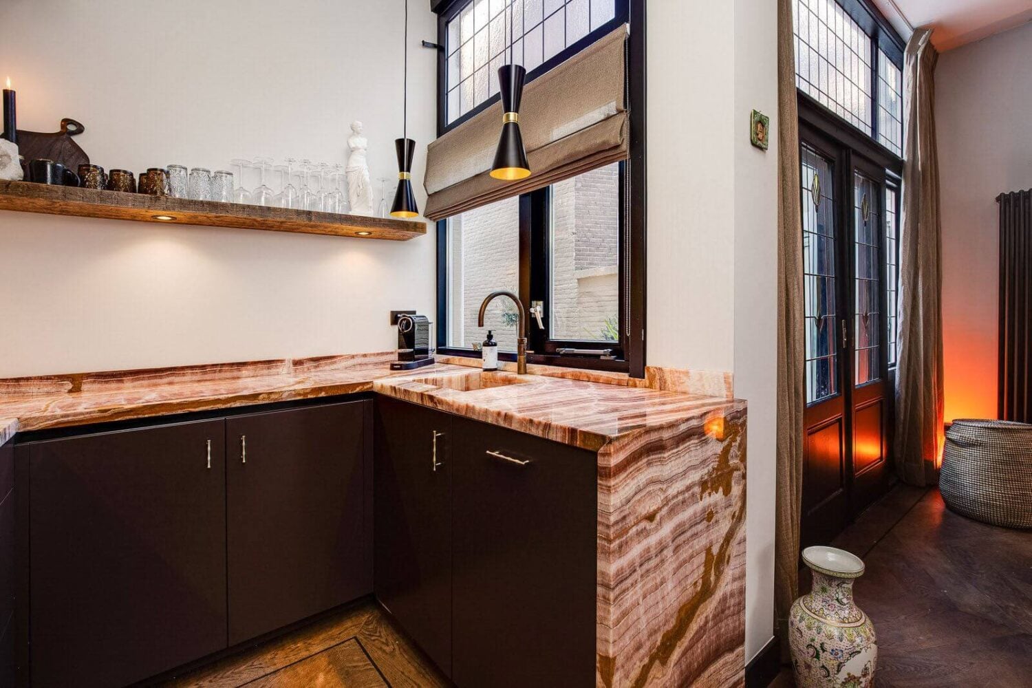 A Dutch Family Home with Warm Color Accents 11 black-kitchen-cabinets-onyx-marble-worktop-dutch-family-home-nordroom