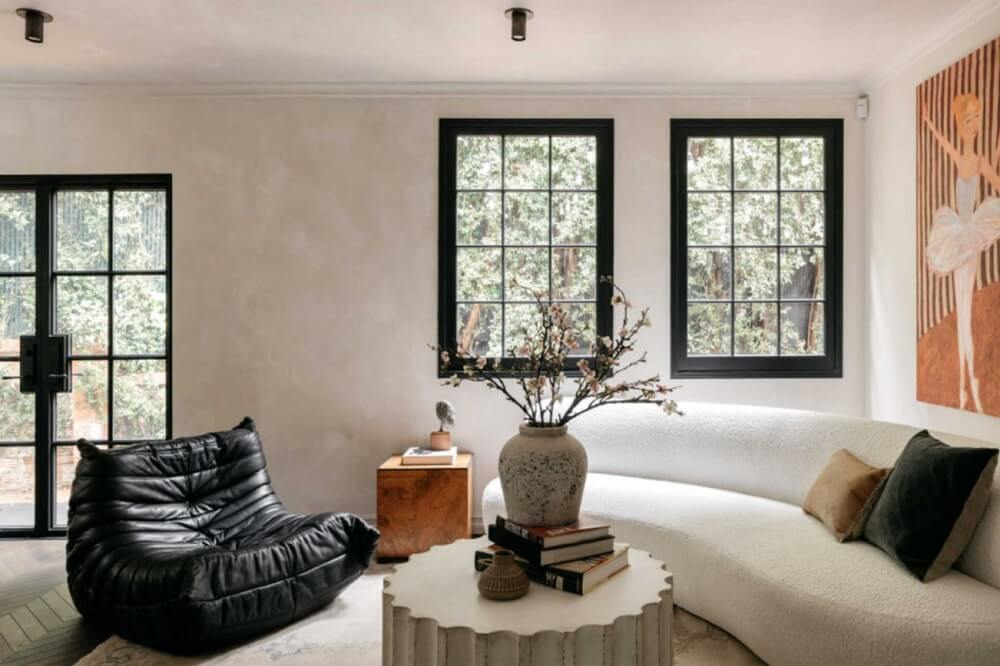 A Beautiful Tudor House in Los Feliz 15 black-white-living-room-curved-sofa-nordroom