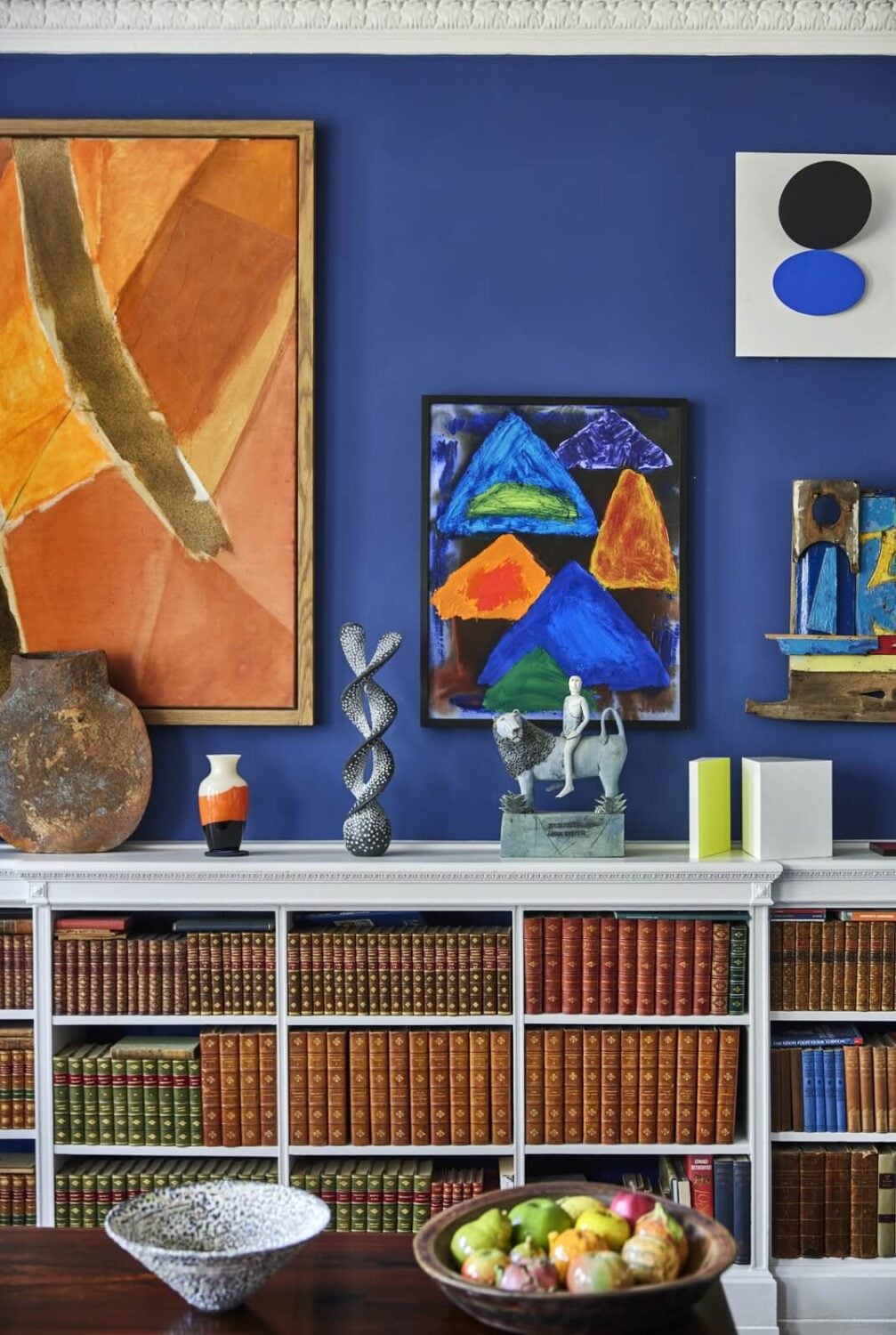 An Eclectic Art-Filled Townhouse in London 3 blue-walls-sitting-room-eclectic-art-filled-home-london-nordroom