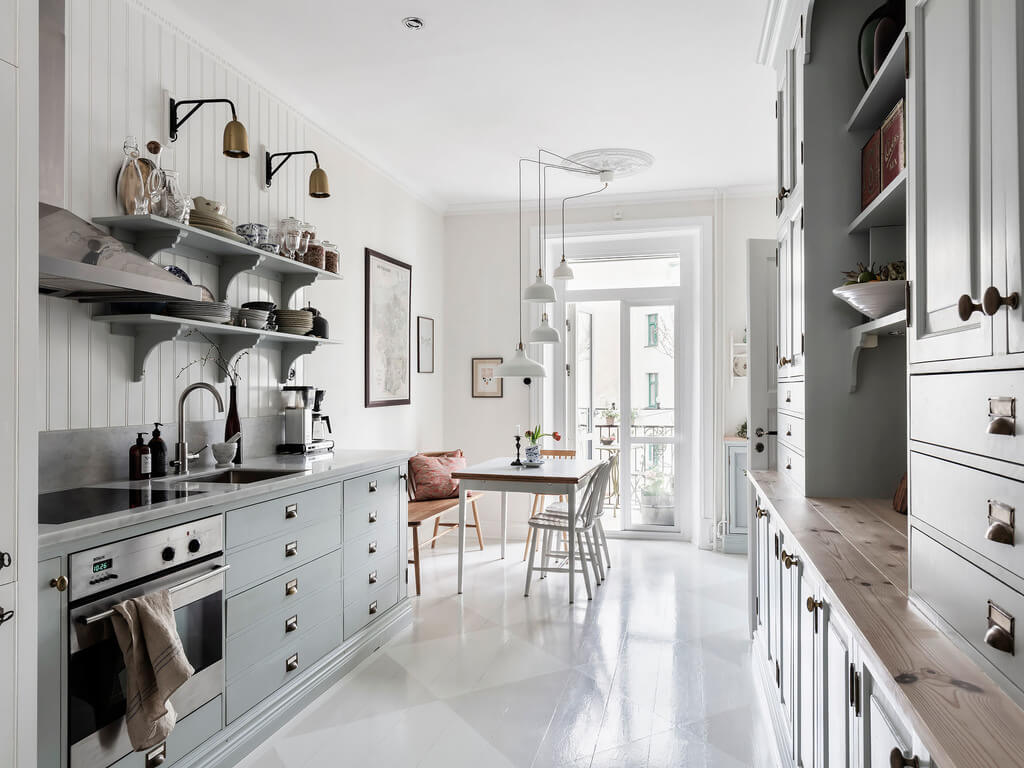 bright-kitchen-painted-wooden-floor-light-blue-cabinets-nordroom