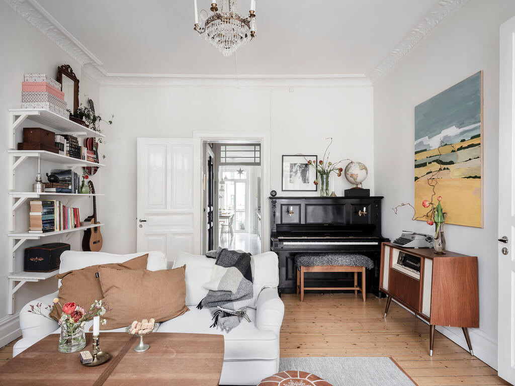 A Bright Nordic Home with Small (but Smartly Designed) Bedrooms 15 bright-living-room-bookshelves-nordroom