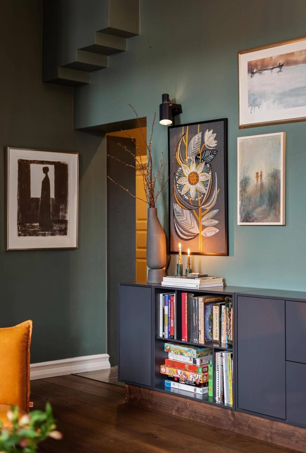 A Moody Family Home in Sweden 4 green-living-room-gray-cabinets-moody-home-nordroom