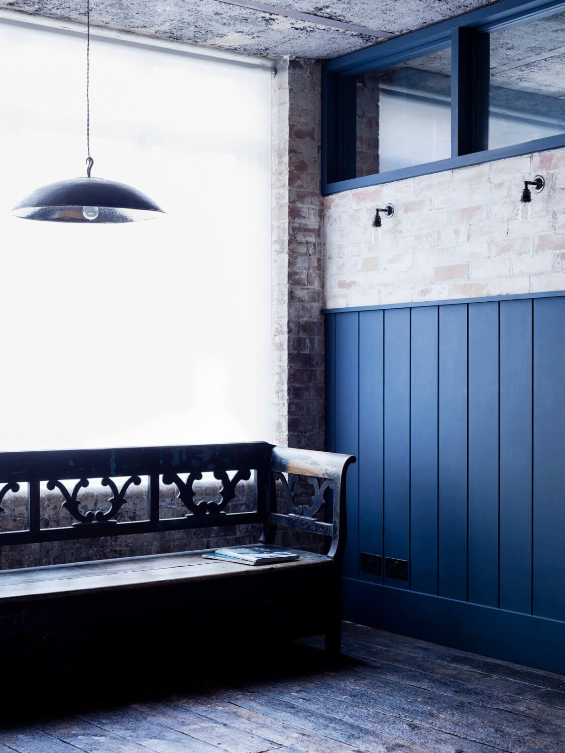 An Industrial Apartment by Mark Lewis Interior Design 19 hallway-blue-cladding-bench-raw-loft-mark-lewis-interior-design-nordroom
