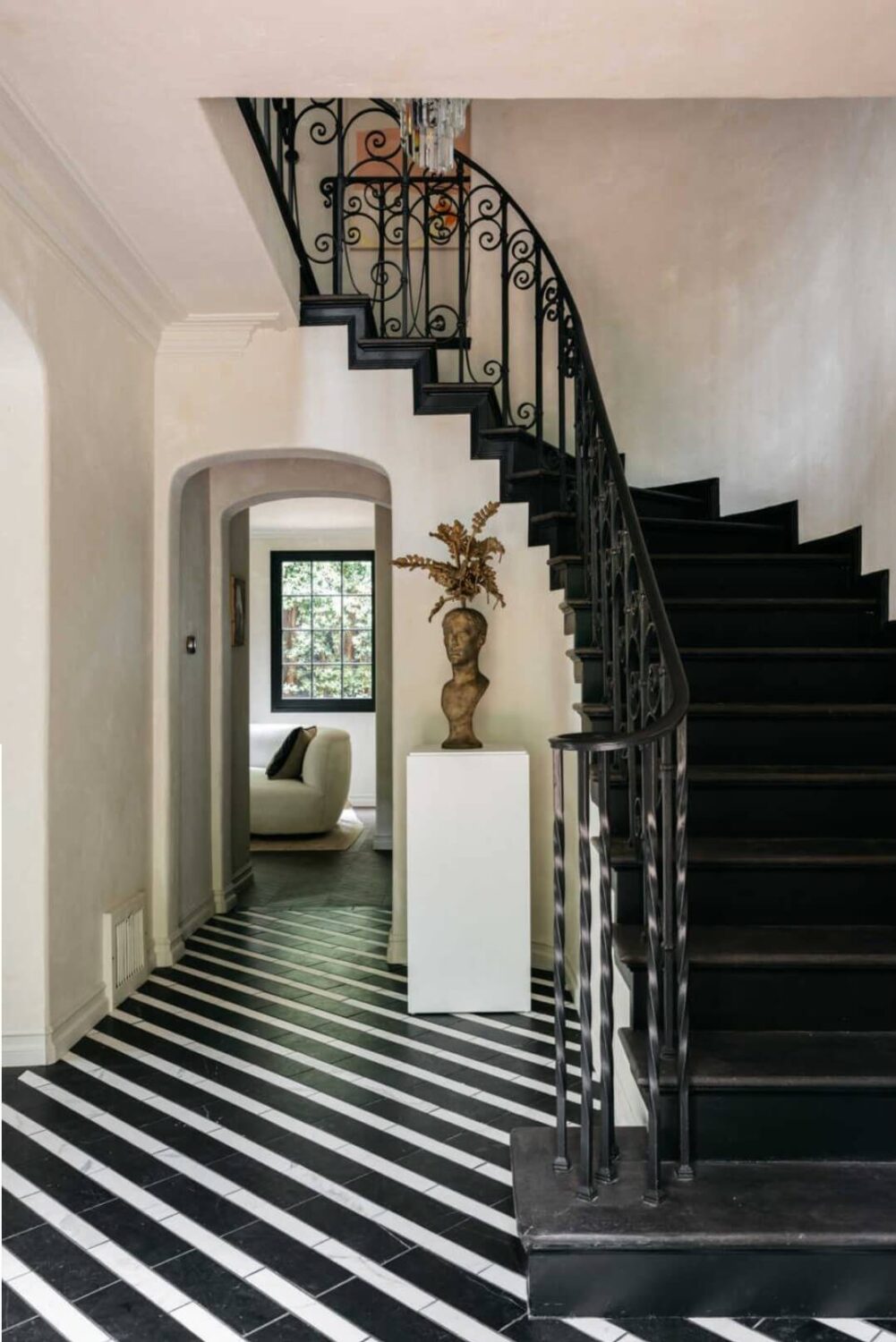 A Beautiful Tudor House in Los Feliz 13 hallway-staircase-black-white-striped-floor-tiles-nordroom