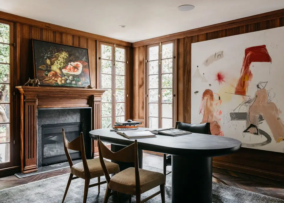 A Beautiful Tudor House in Los Feliz 19 home-office-oval-black-table-wood-paneled-walls-nordroom