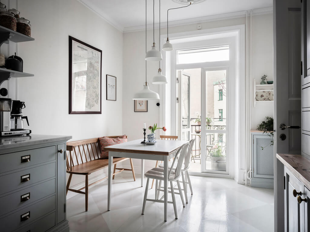 A Bright Nordic Home with Small (but Smartly Designed) Bedrooms 7 kitchen-dining-area-balcony-painted-wooden-floor-nordroom