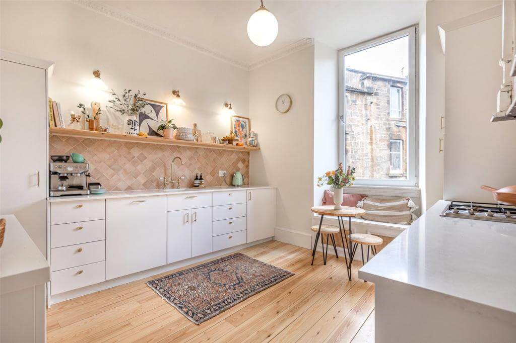 Kate Spiers Sells Her Beautiful Light Flat in Glasgow 5 kitchen-wooden-floor-white-kitchen-cabinets-window-seat-kate-spiers-glasgow-apartment-nordroom