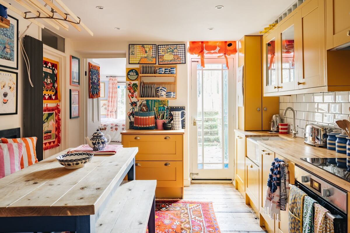 Yellow Kitchen Design Ideas (with Paint Colors) 1 kitchen-yellow-cabinets-bench-india-yellow-farrow-ball-maximalist-decor-nordroom