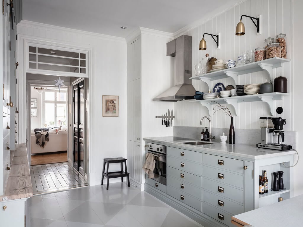 A Bright Nordic Home with Small (but Smartly Designed) Bedrooms 4 light-blue-kitchen-cabinets-open-shelves-nordroom