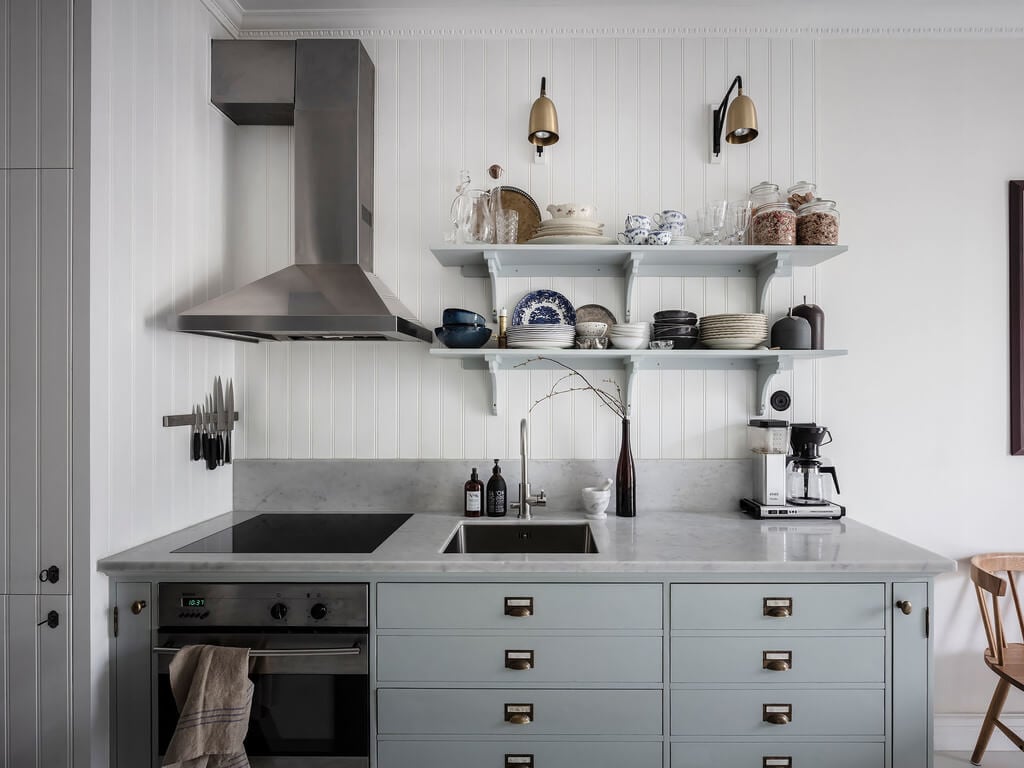 A Bright Nordic Home with Small (but Smartly Designed) Bedrooms 3 light-blue-kitchen-cabinets-scandi-kitchen-nordroom