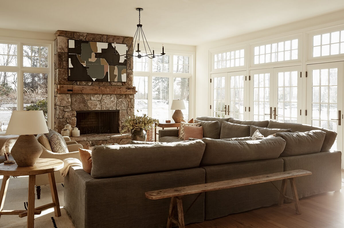 A Warm Family Home in Connecticut 6 light-sitting-room-corner-sofa-stone-fireplace-nordroom