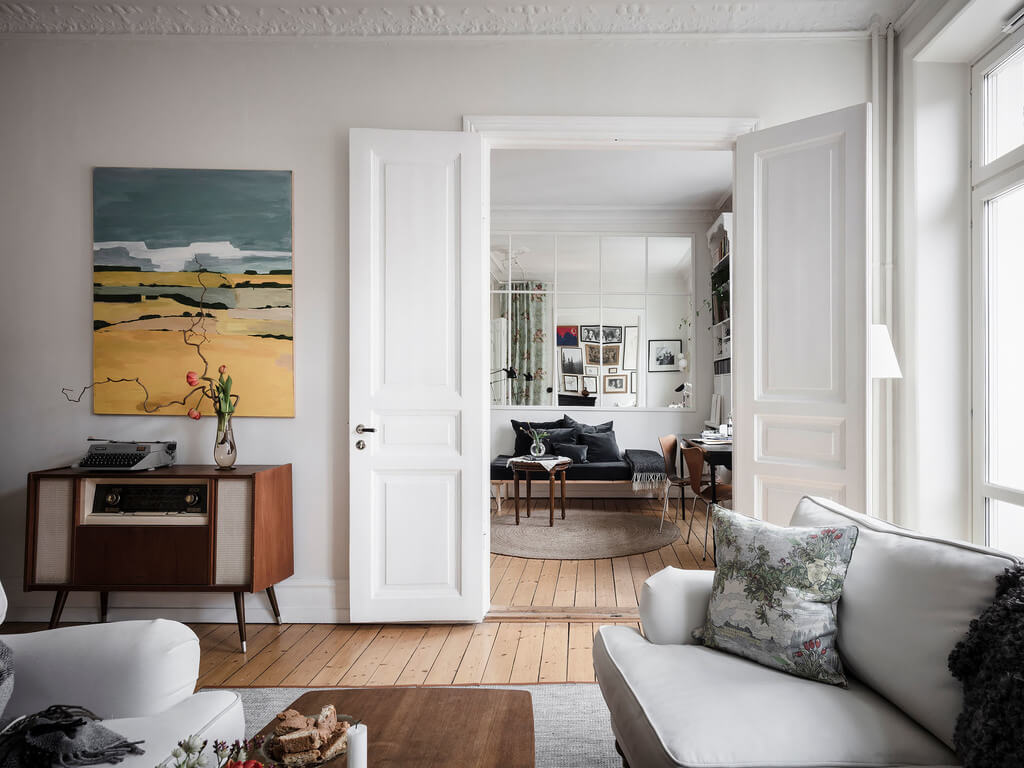 A Bright Nordic Home with Small (but Smartly Designed) Bedrooms 16 living-room-double-doors-office-wooden-floor-nordorom