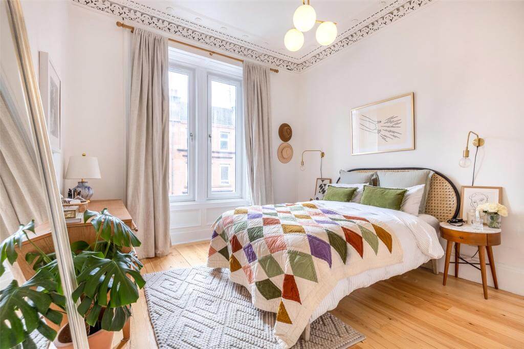 Kate Spiers Sells Her Beautiful Light Flat in Glasgow 10 master-bedroom-cane-headboard-period-details-wooden-floor-kate-spiers-nordroom