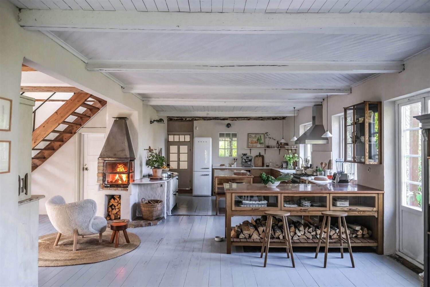 Best of 2022: Kitchens 6 open-plan-kitchen-devol-haberdasher-sitting-room-fireplace-countryside-home-our-food-stories-nordroom
