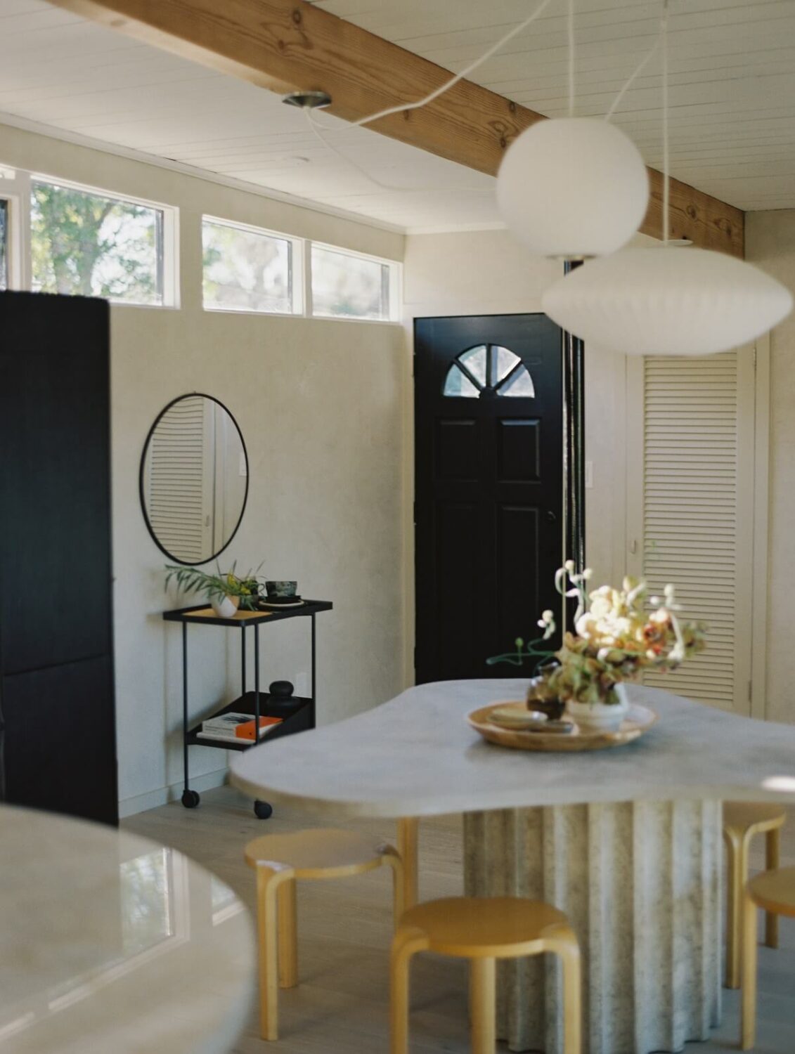 Japandi Design in a Midcentury Home in Los Angeles 13 organic-shape-dining-table-stools-nordroom