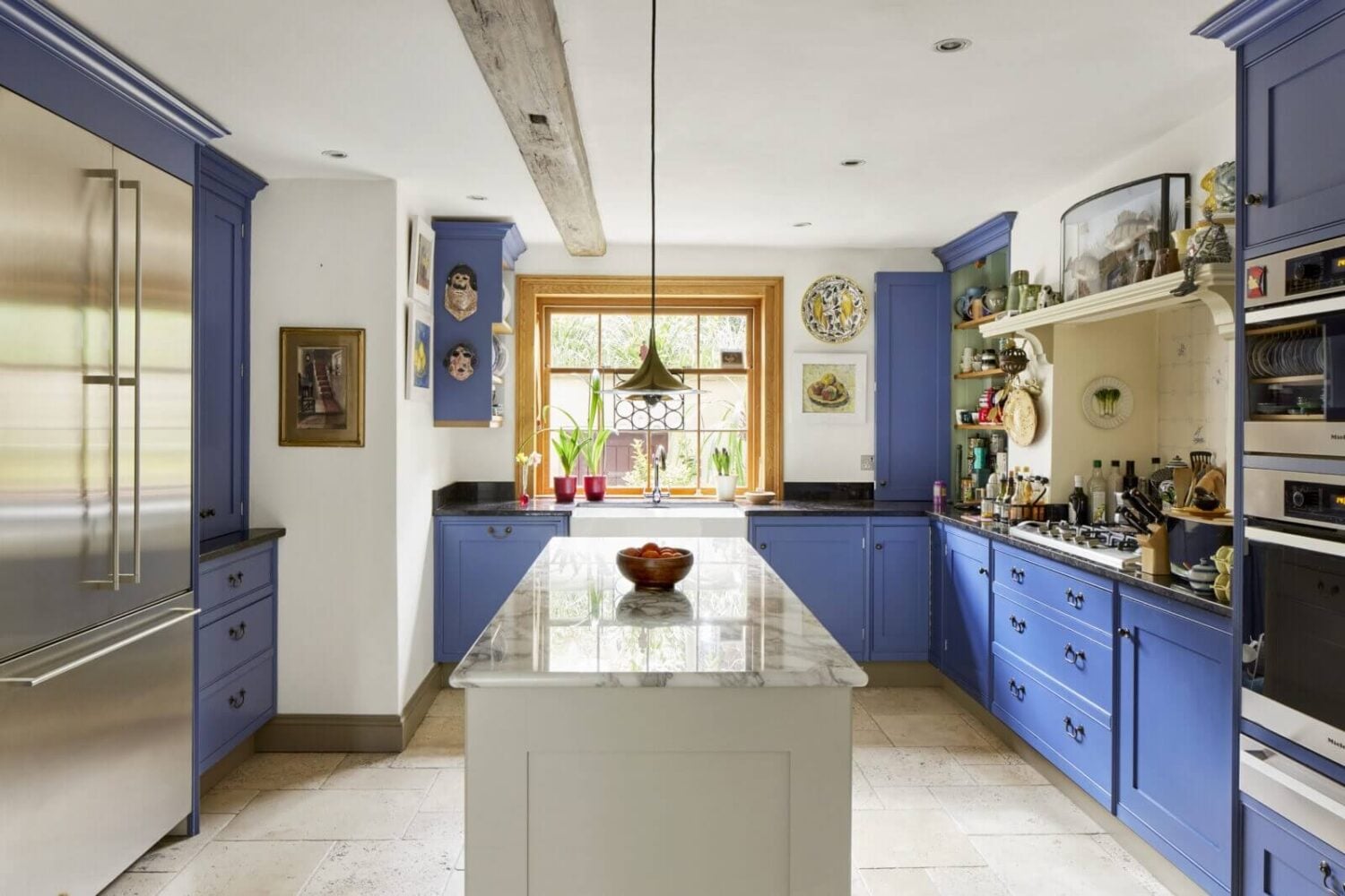 An Eclectic Art-Filled Townhouse in London 8 purple-blue-kitchen-cabinets-eclectic-home-london-nordroom