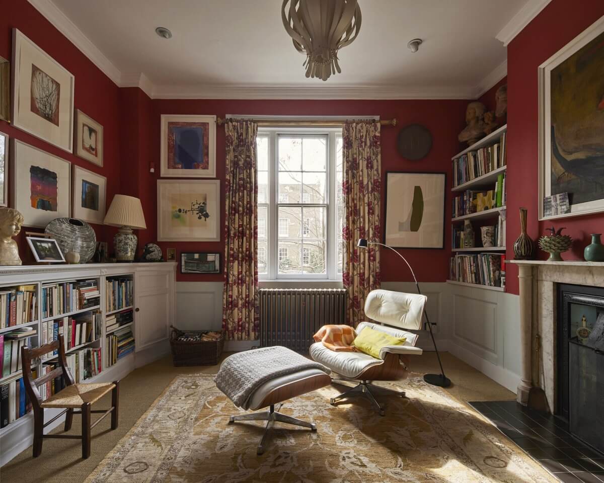 An Eclectic Art-Filled Townhouse in London 4 red-reading-room-bookshelves-fireplace-nordroom