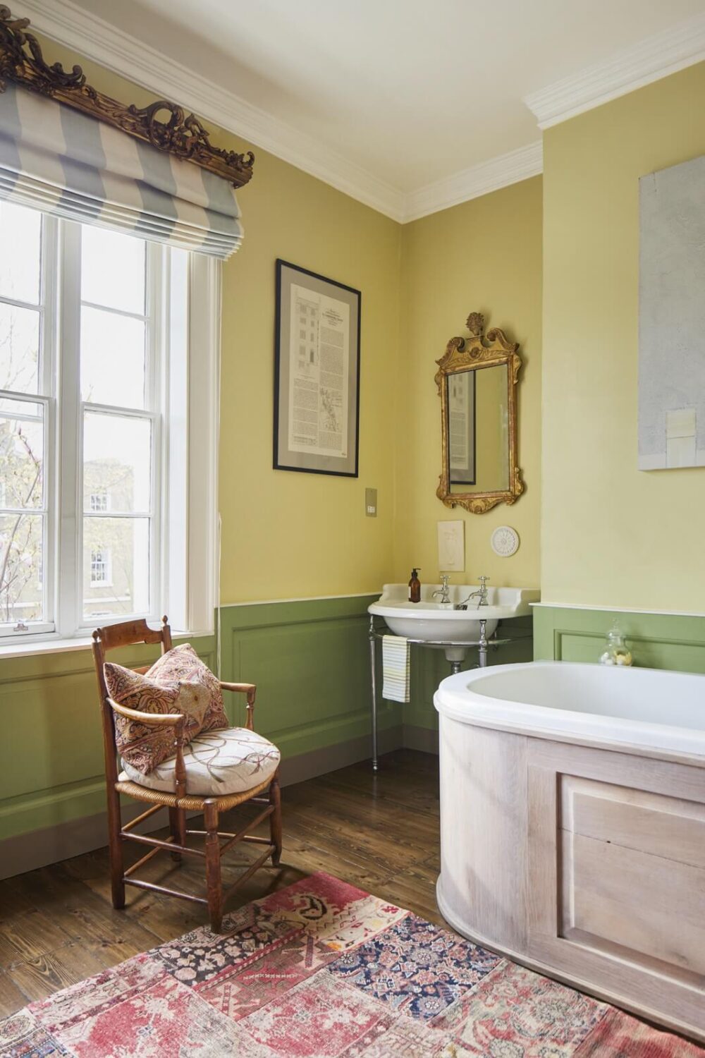 An Eclectic Art-Filled Townhouse in London 14 vintage-bathroom-green-paneling-yellow-walls-nordroom
