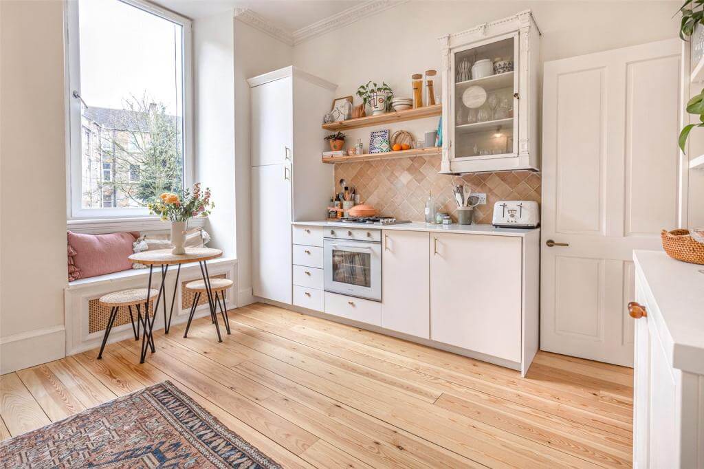 Kate Spiers Sells Her Beautiful Light Flat in Glasgow 6 white-kitchen-cabinets-window-seat-wooden-floor-period-home-nordroom