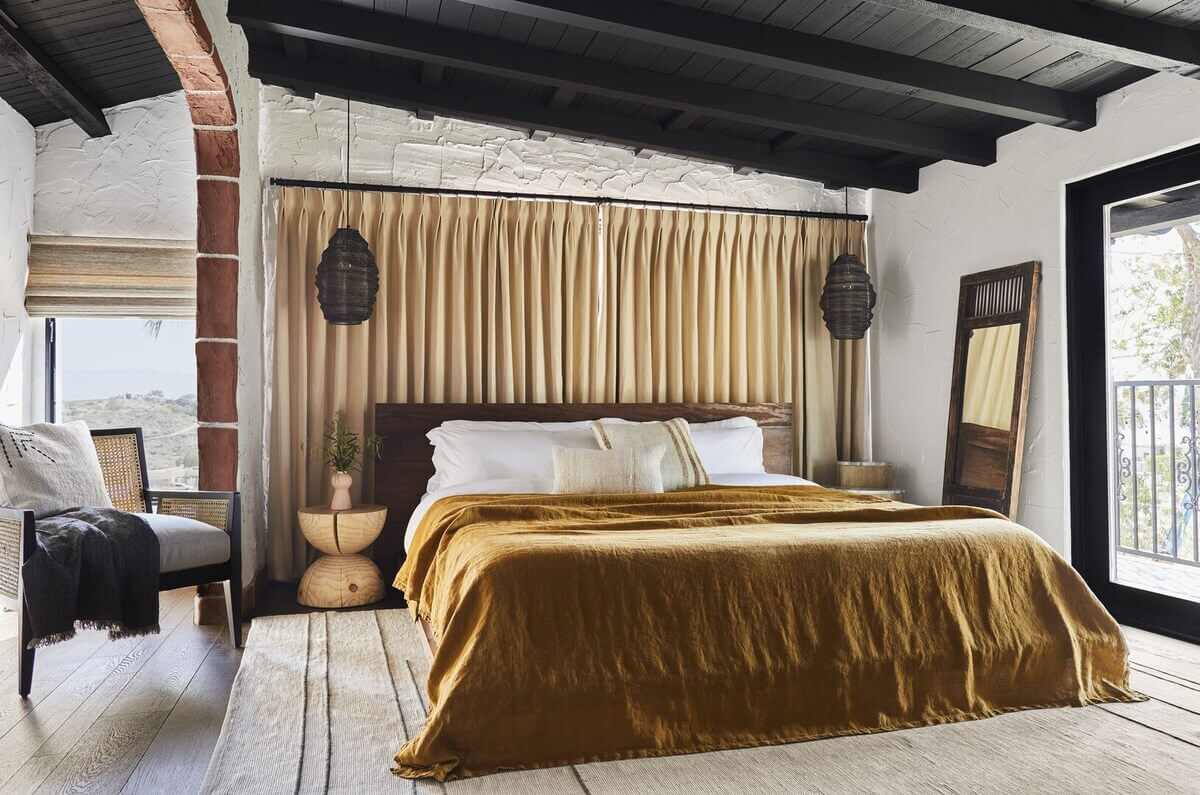 Queer Eye's Bobby Berk Designed An Airbnb Villa in California 15 bedroom-mustard-yellow-throw-wooden-headboard-nordroom