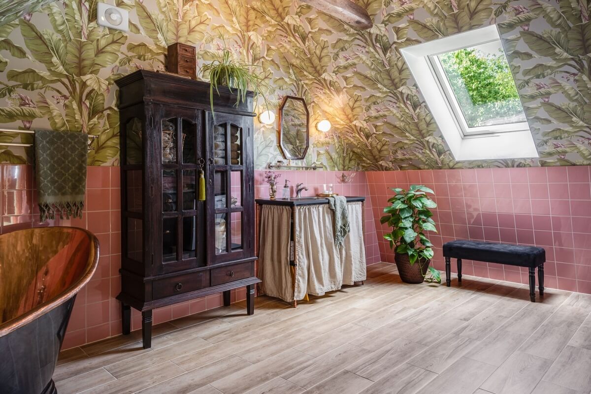A Colorful Family Home in a Former School Building 29 attic-bathroom-pink-tiles-copper-bath-wallpaper-skylight-nordroom