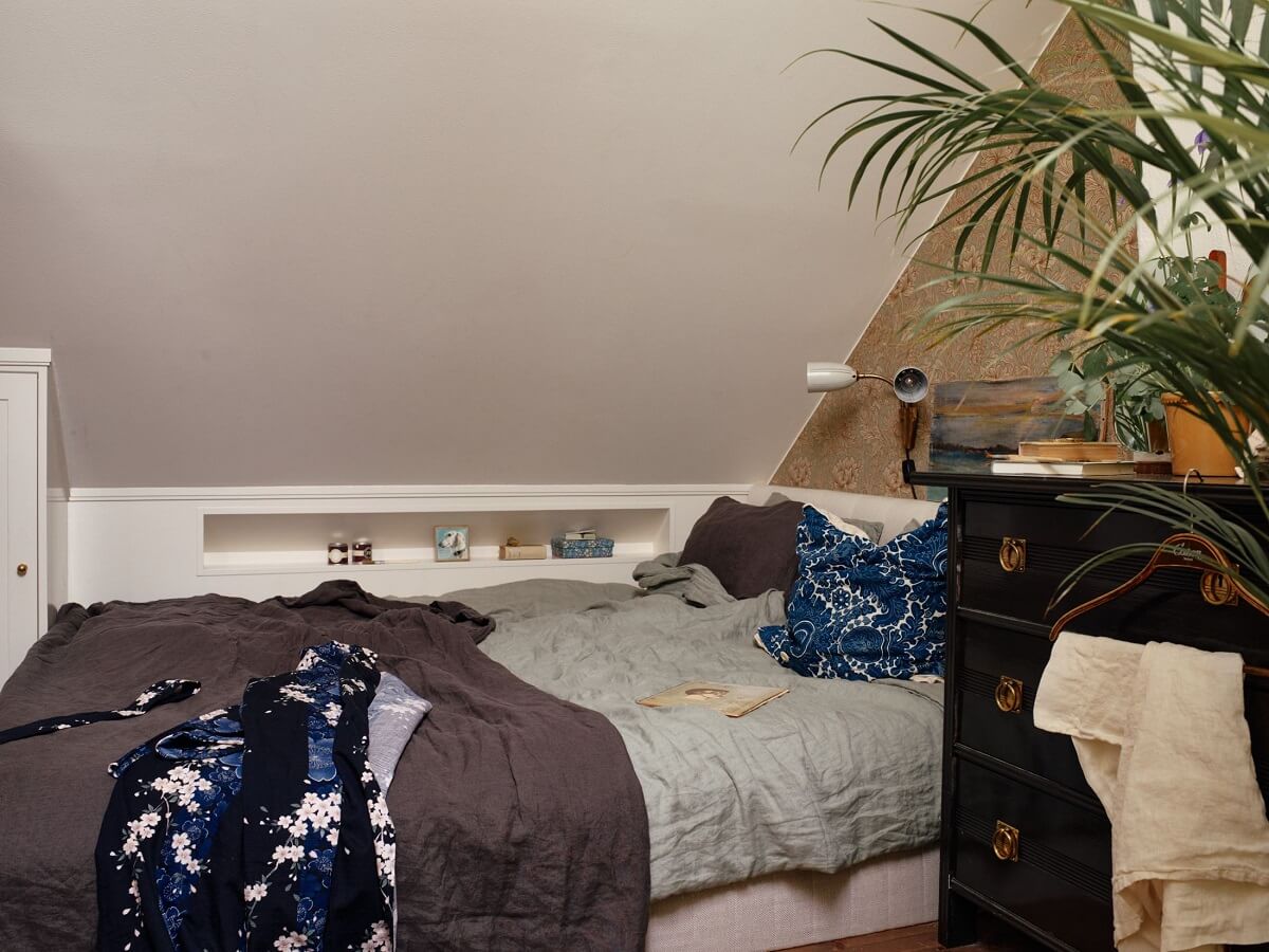 A Cozy Vintage Bohemian Maisonette in Sweden 22 attic-bedroom-antique-dresser-nordroom
