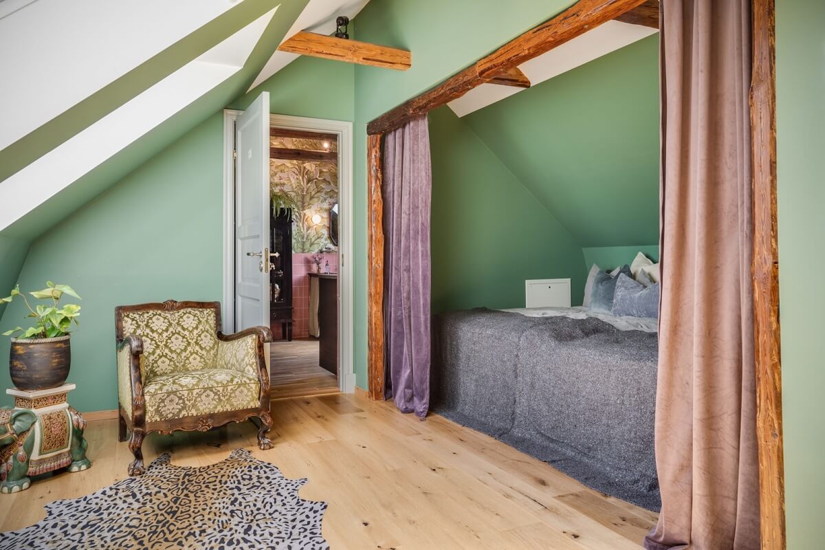 A Colorful Family Home in a Former School Building 28 attic-bedroom-green-walls-exposed-beams-bed-nook-nordroom